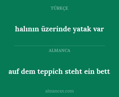 auf dem teppich steht ein bett - halının üzerinde yatak var