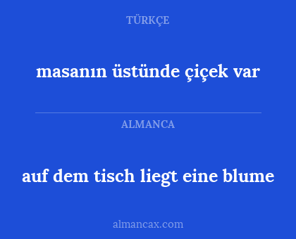 masanın üstünde çiçek var - auf dem tisch liegt eine blume