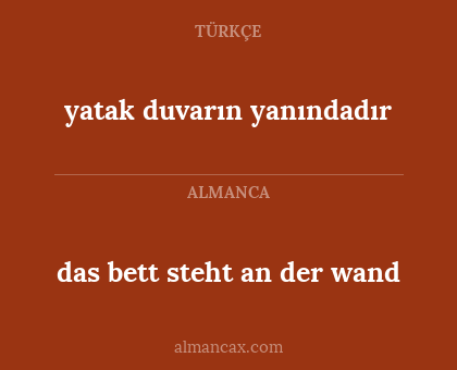das bett steht an der wand - yatak duvarın yanındadır